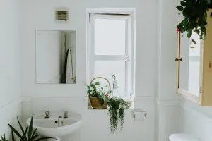 bathroom with open cabinet shelves