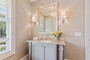 Bathroom with lights over the vanity mirror