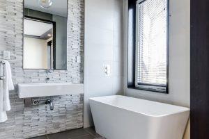 bathroom with one wall with beadboard