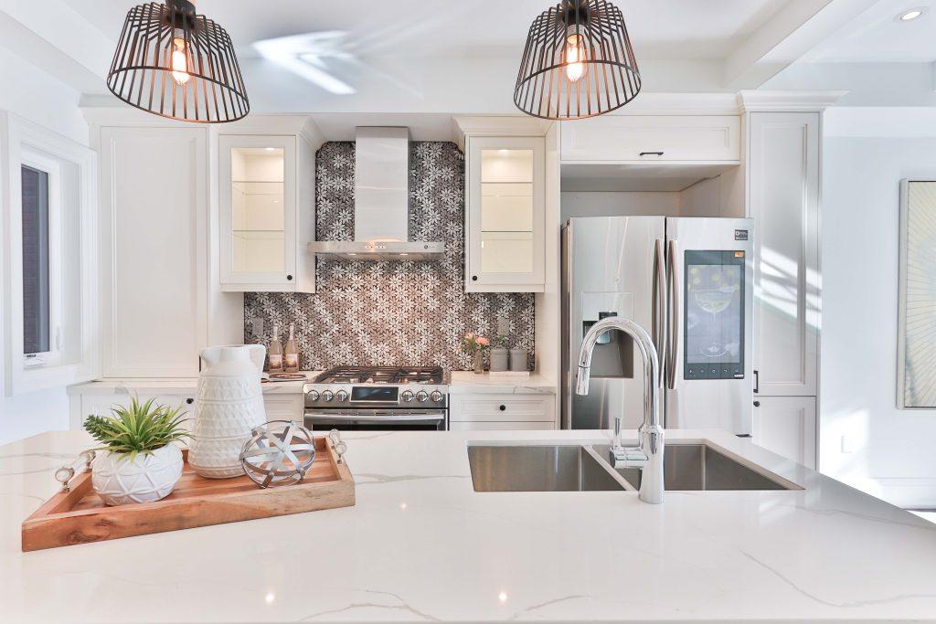 white kitchen with eye-catching tiles used as backsplash