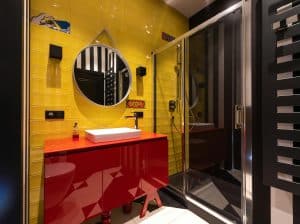 A clean, modern small bathroom featuring light colors and minimalist decor, creating an open and airy feel.